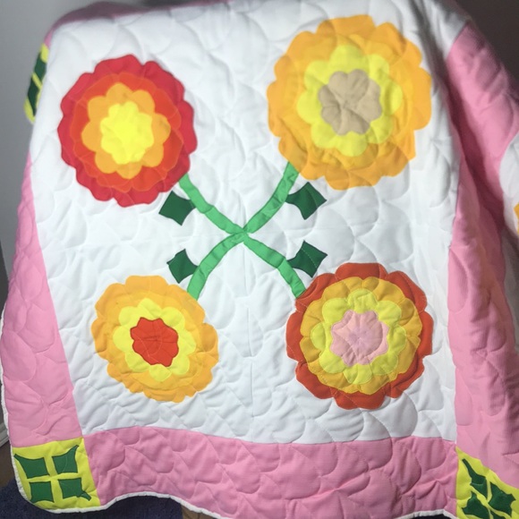 Never been used. Beautiful floral quilt. Very old